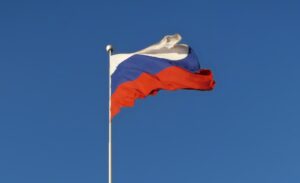 Russian flag on a flagpole, blowing in the wind