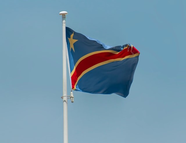 The flag of the Democratic Republic of the Congo blowing in the wind.