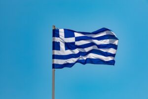 The flag of Greece against a blue sky background