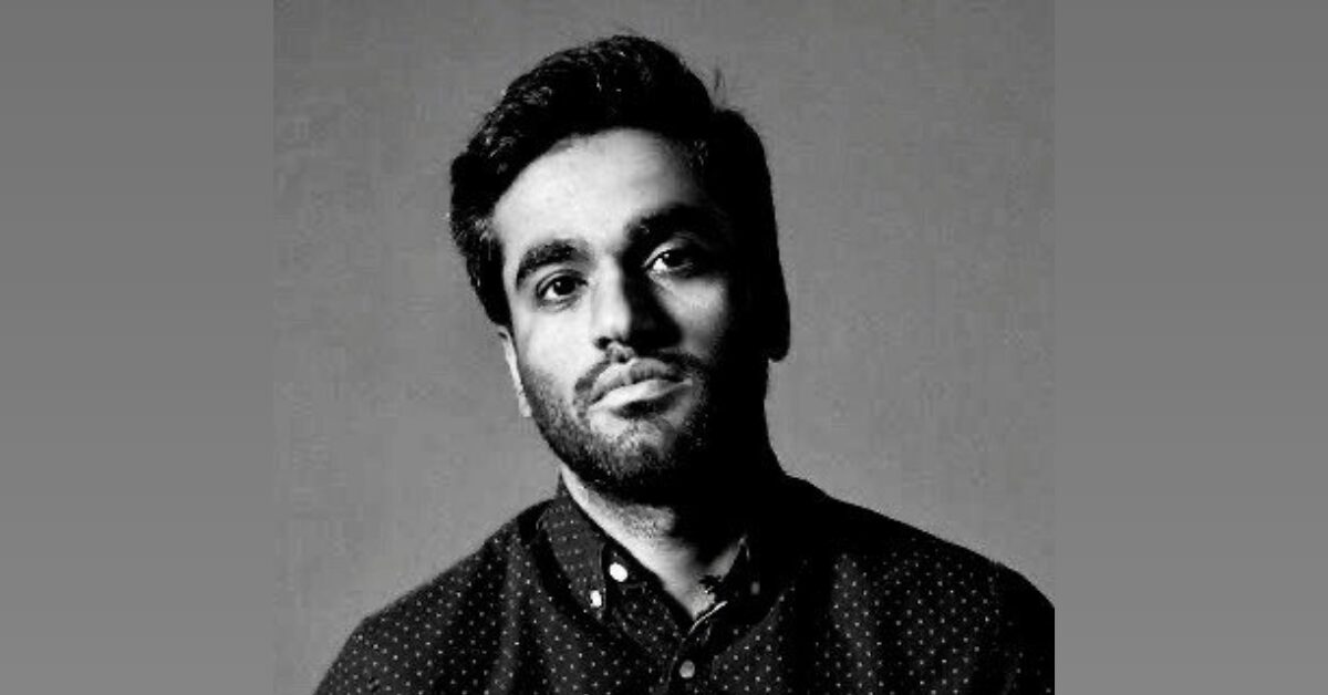 A black and white photograph of Baloch human rights defender Lateef Johar Baloch