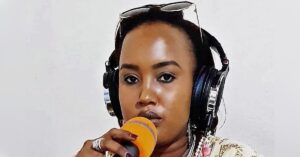 Burundi journalist and woman human rights defender Floriane Irangabiye speaking at a microphone with a radio headset on.