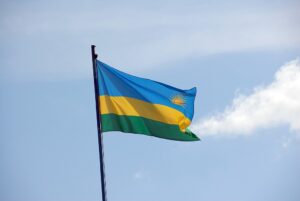 Rwanda Flag Against Light Blue Sky. Photo by Dave Proffer via Wikimedia Commons