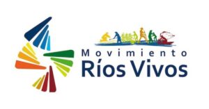 Logo of Movimiento Ríos Vivos, a Colombian environmental movement. The logo features colourful abstract shapes arranged in a circular pattern on the left, with colours transitioning from dark blue to green, yellow, and red. To the right are silhouettes of people engaged in various river-related activities, including fishing and farming. The text reads 'Movimiento Ríos Vivos' in bold, with 'Ríos Vivos' larger and in dark blue.