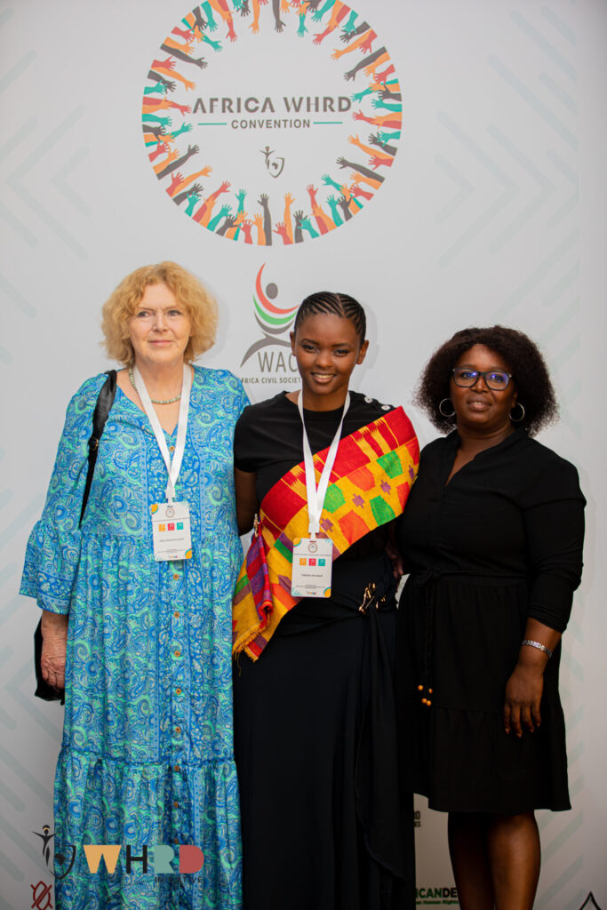 UN Special Rapporteur on human rights defenders Mary Lawlor standing with two women human rights defenders during the WHRD Convention in Accra, Ghana.