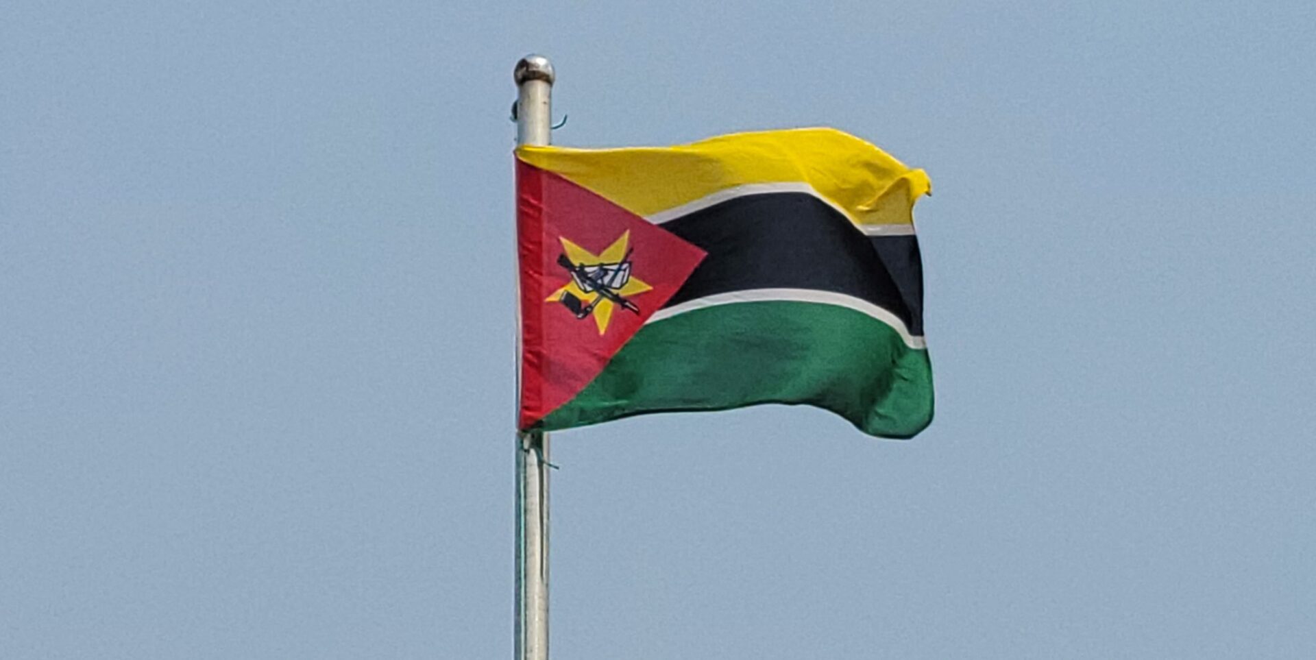 The flag of Mozambique flying in the wind