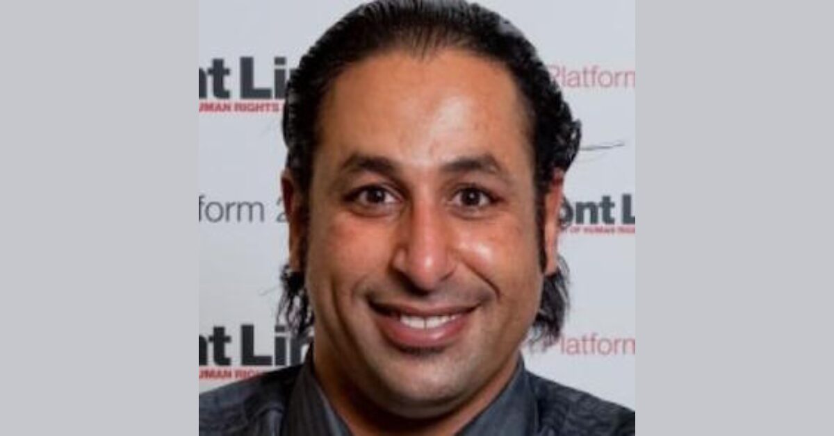 A close up photo of Bahraini blogger and human rights defender Naji Fateel smiling at the camera.
