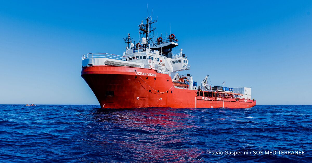 The Ocean Viking, a red and white rescue ship operated by SOS Méditerranée, sailing the sea on a clear day. Photo by Flavio Gasperini / SOS Méditerranée.